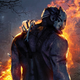 A scary, masked killer stands alone in the woods near a large fire.